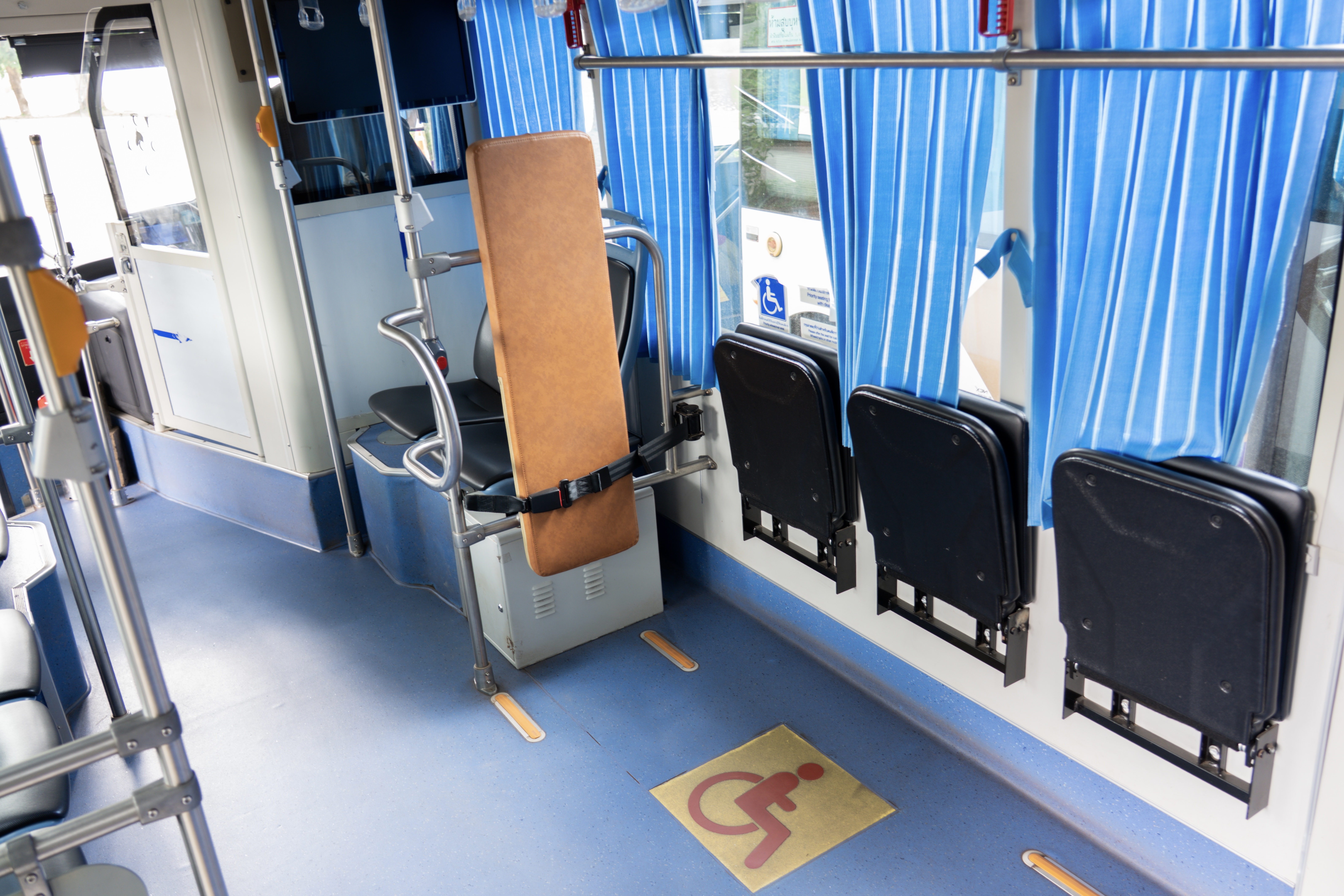 Interior of public electric bus with wheelchair space