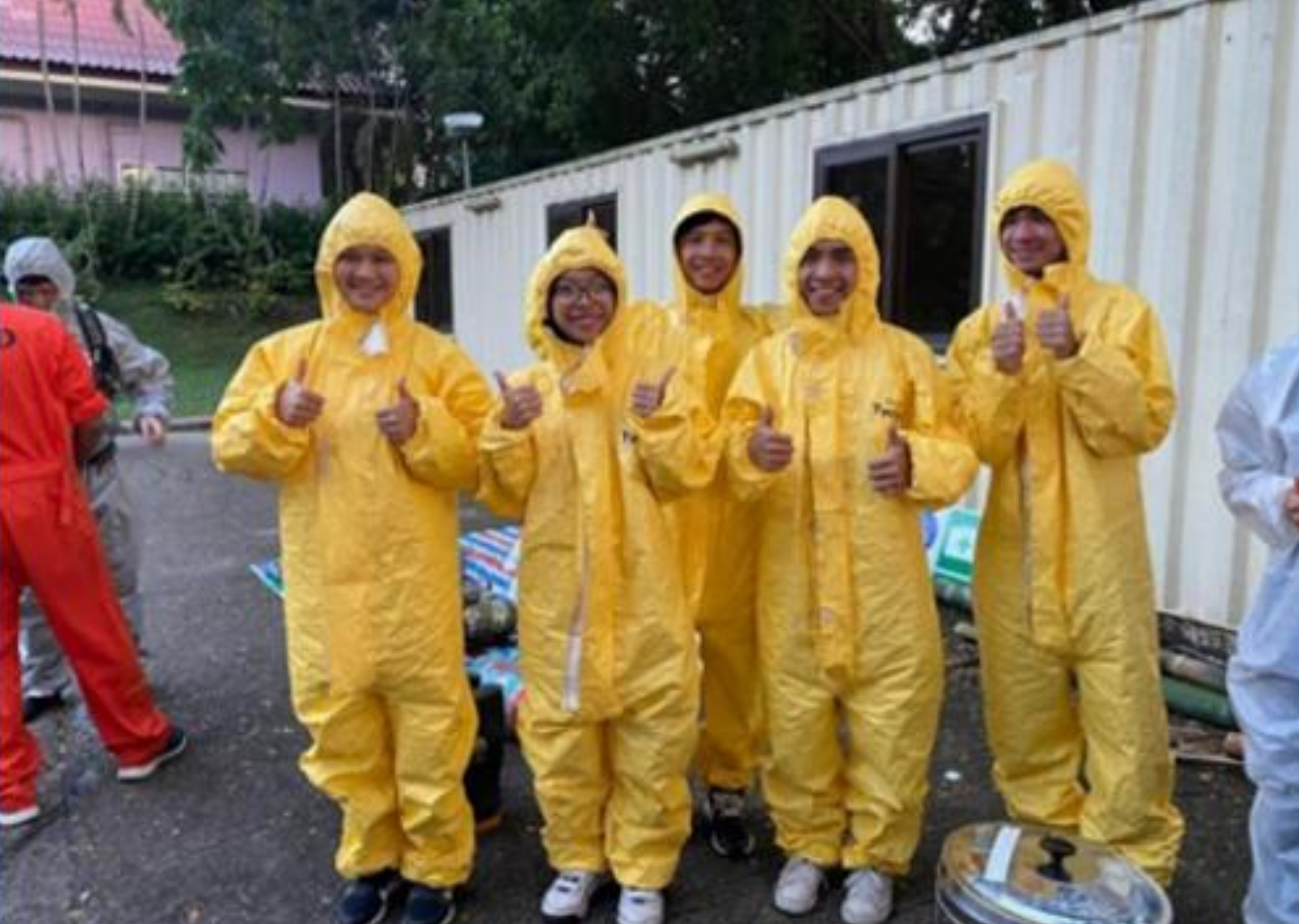 Staff participating in chemical hazardous waste emergency drill
