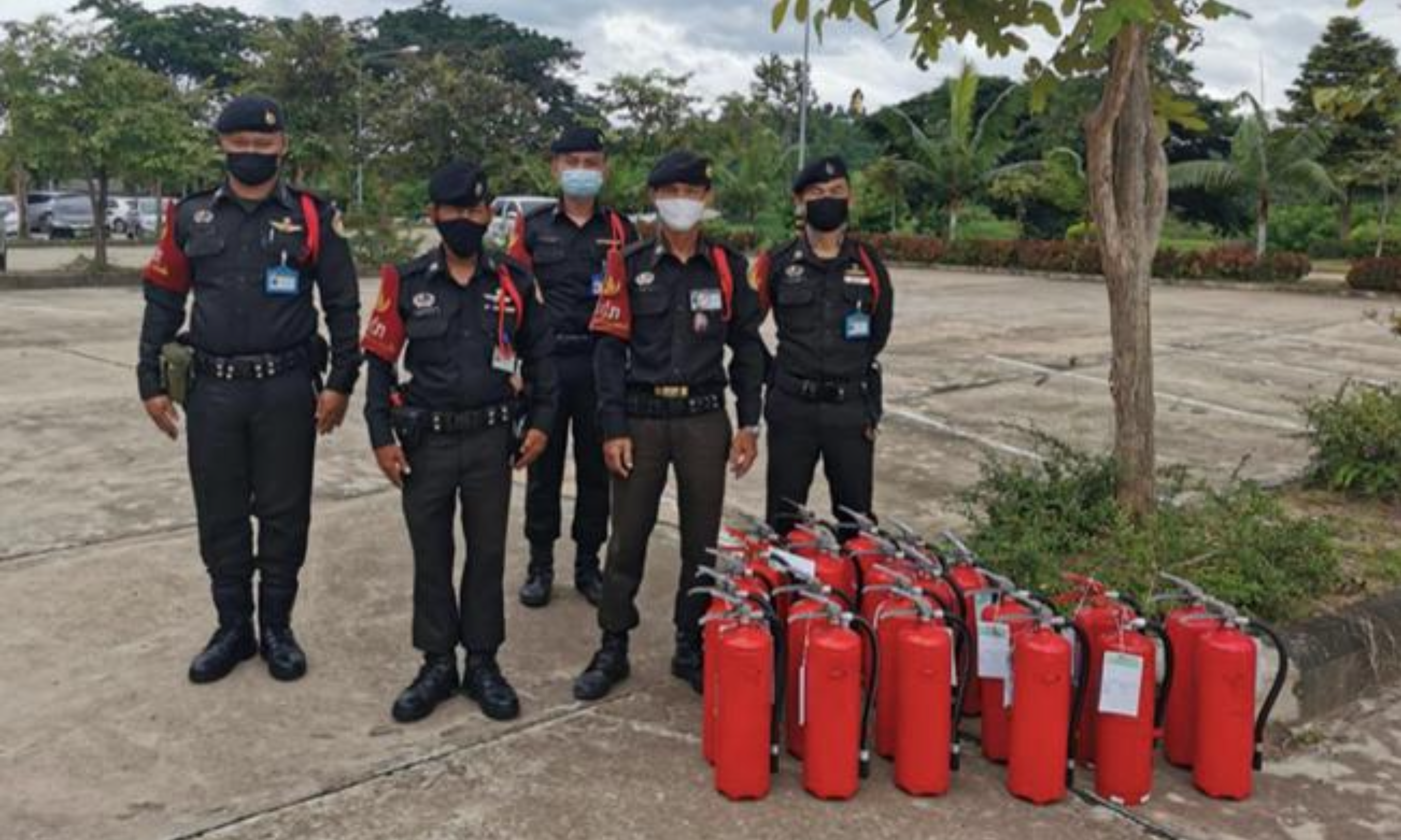Security officers with fire extinguishers at University of Phayao