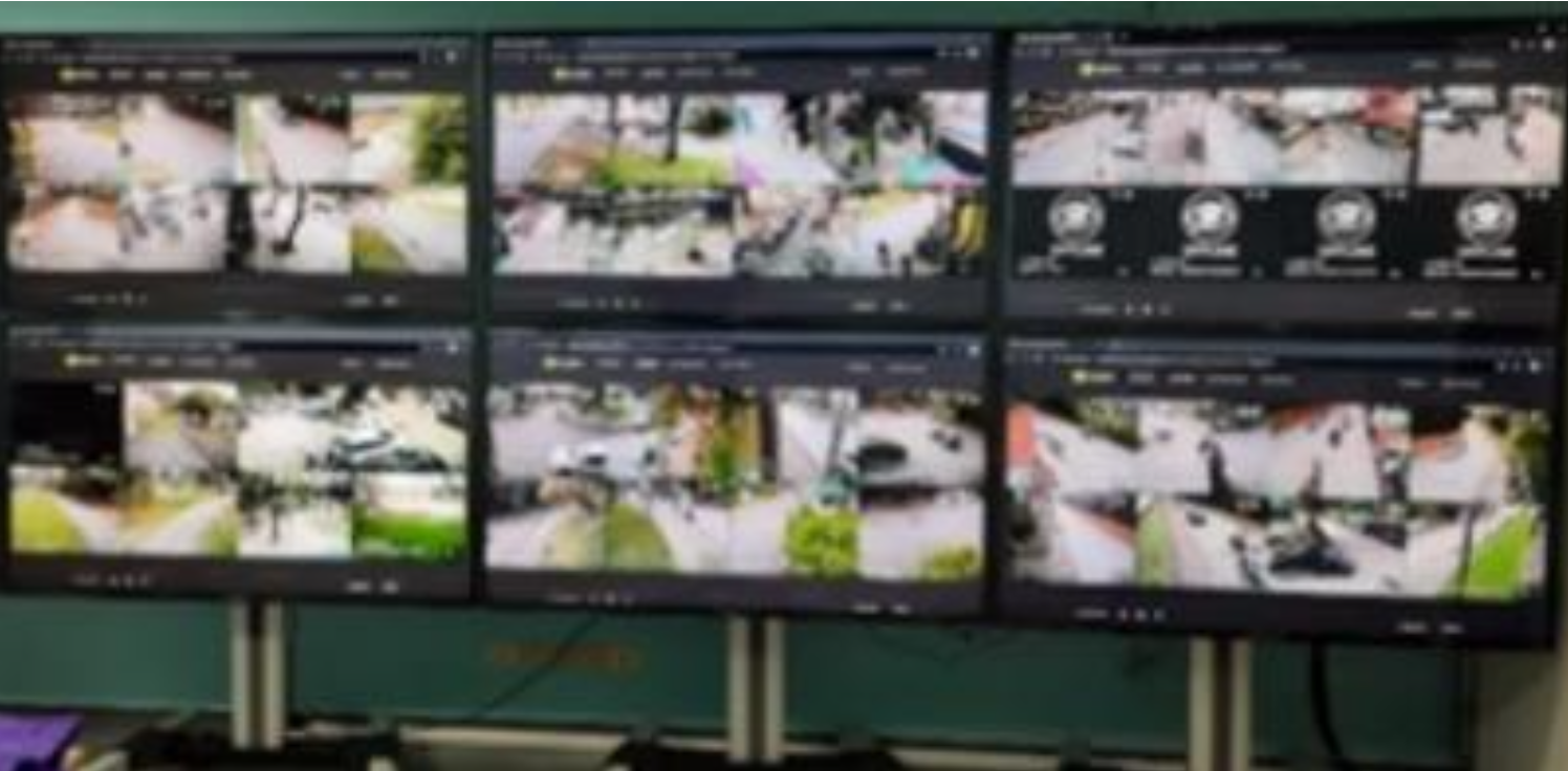 CCTV control room with multiple camera feeds, University of Phayao