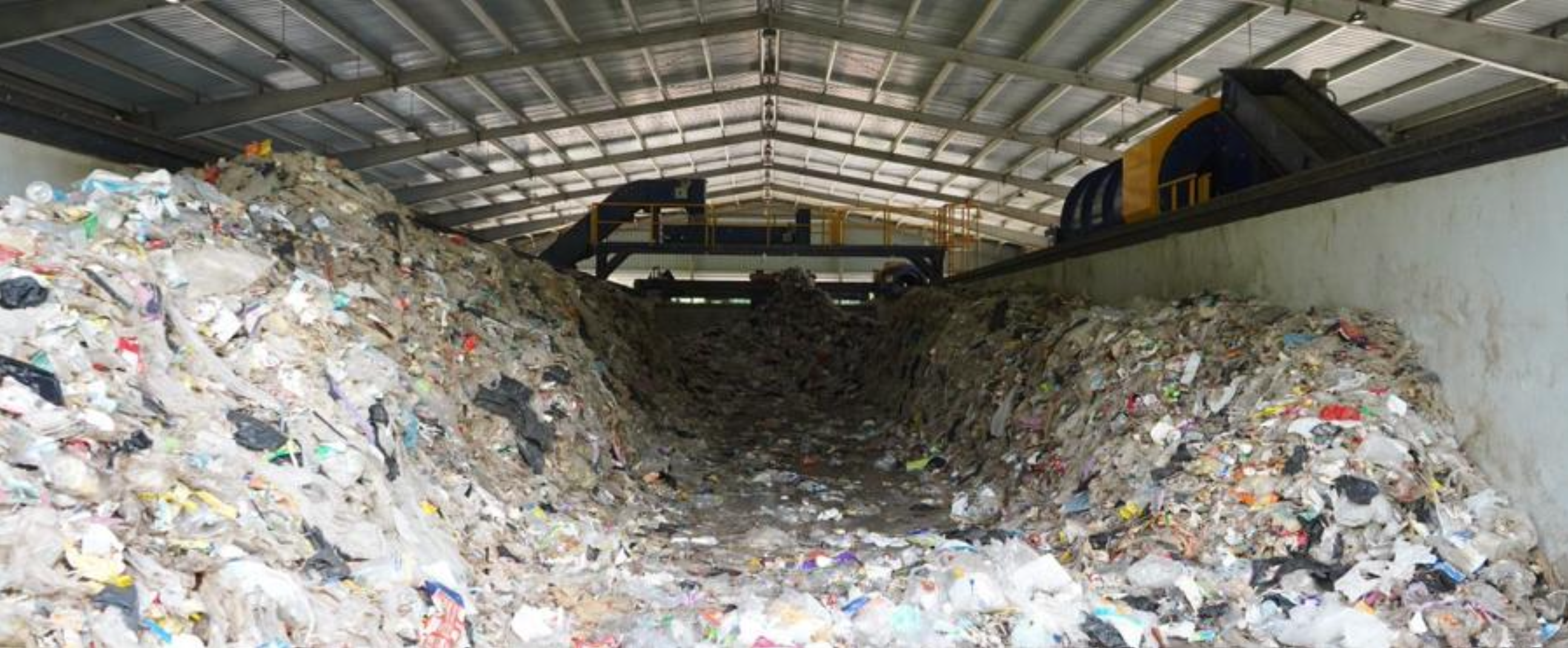 Large pile of sorted waste inside MBT facility