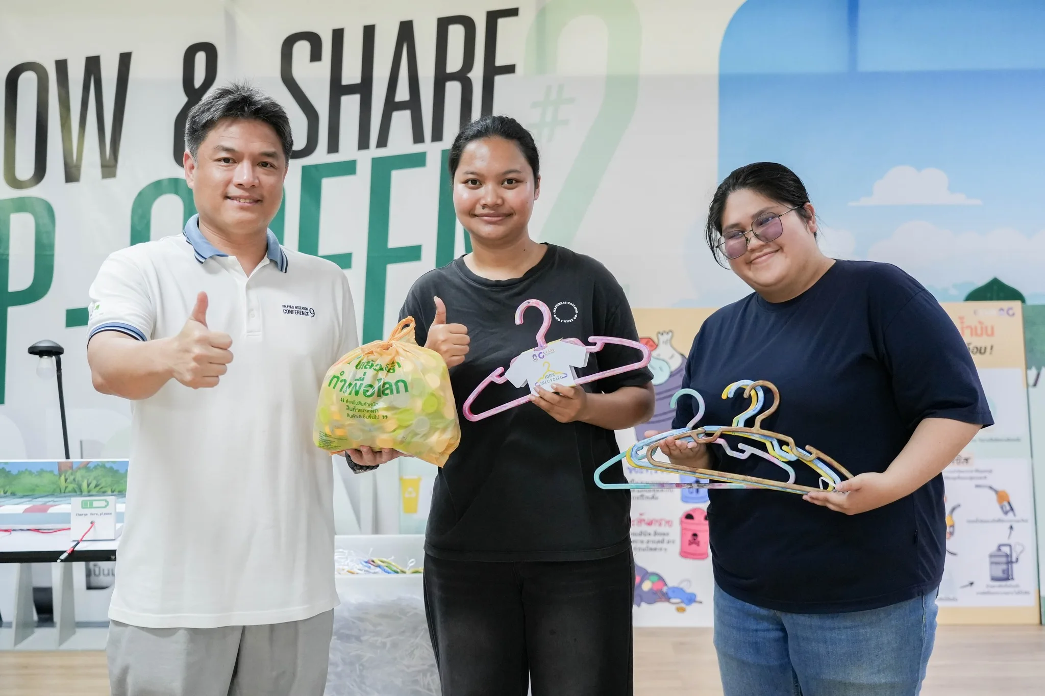 Staff holding recycled plastic hangers