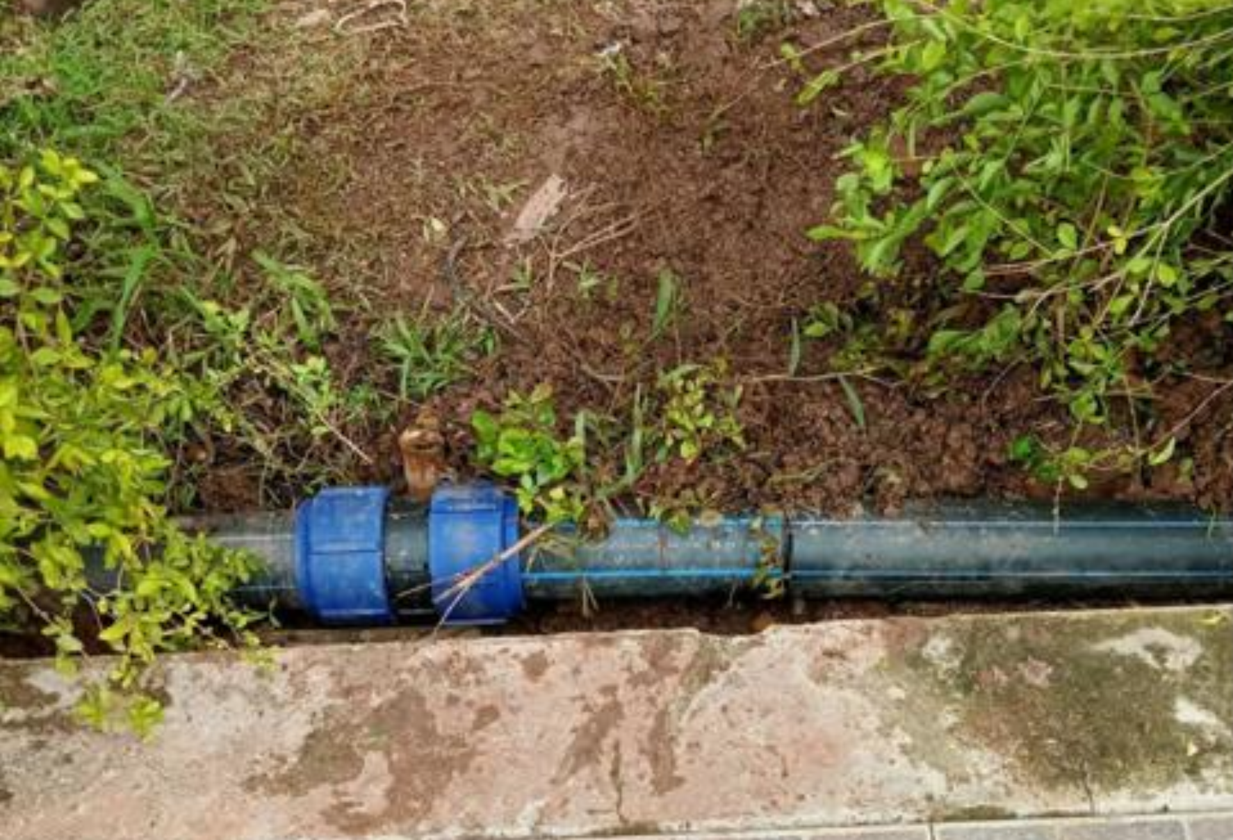 Treated water pipe installed beside a walkway