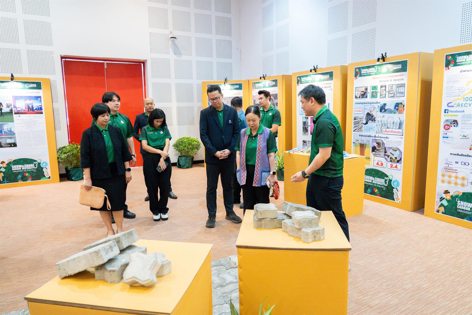 Group photo of students and staff at Show and Share UP Green 2025 with SDG banners