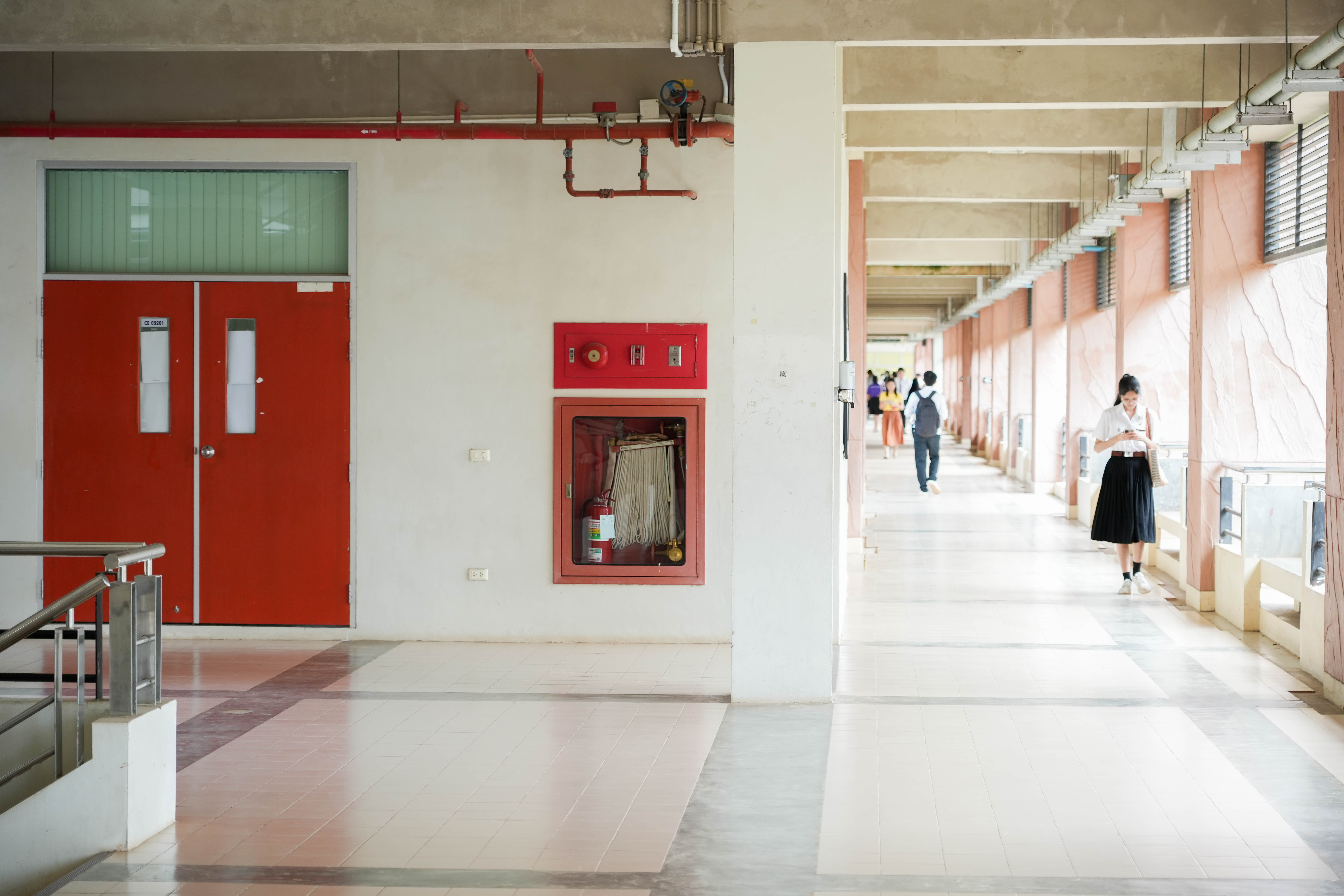 Corridor with emergency exit and fire equipment