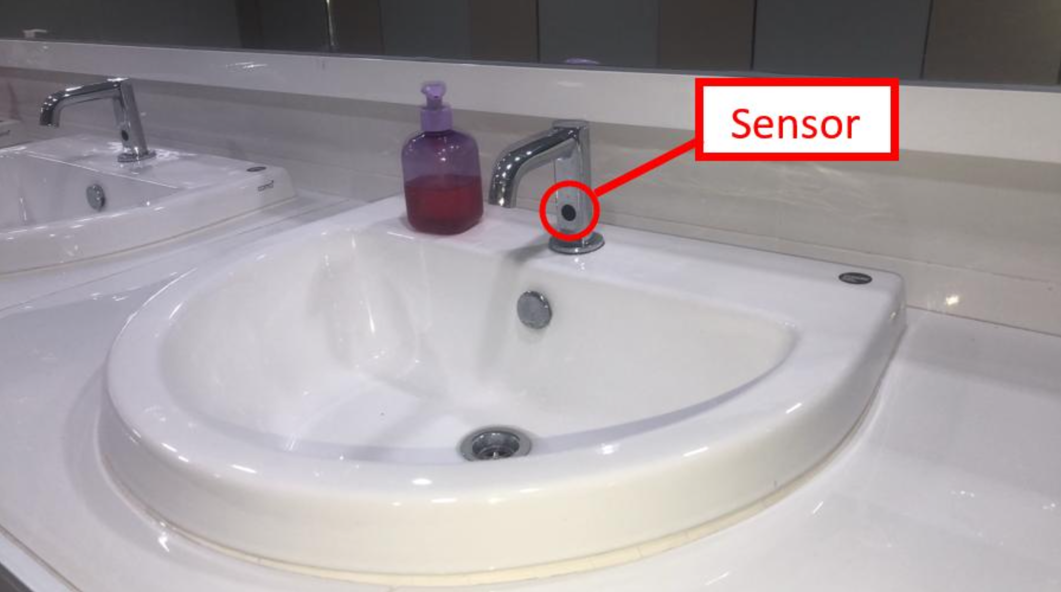 Sink faucet with sensor labeled for water-saving operation