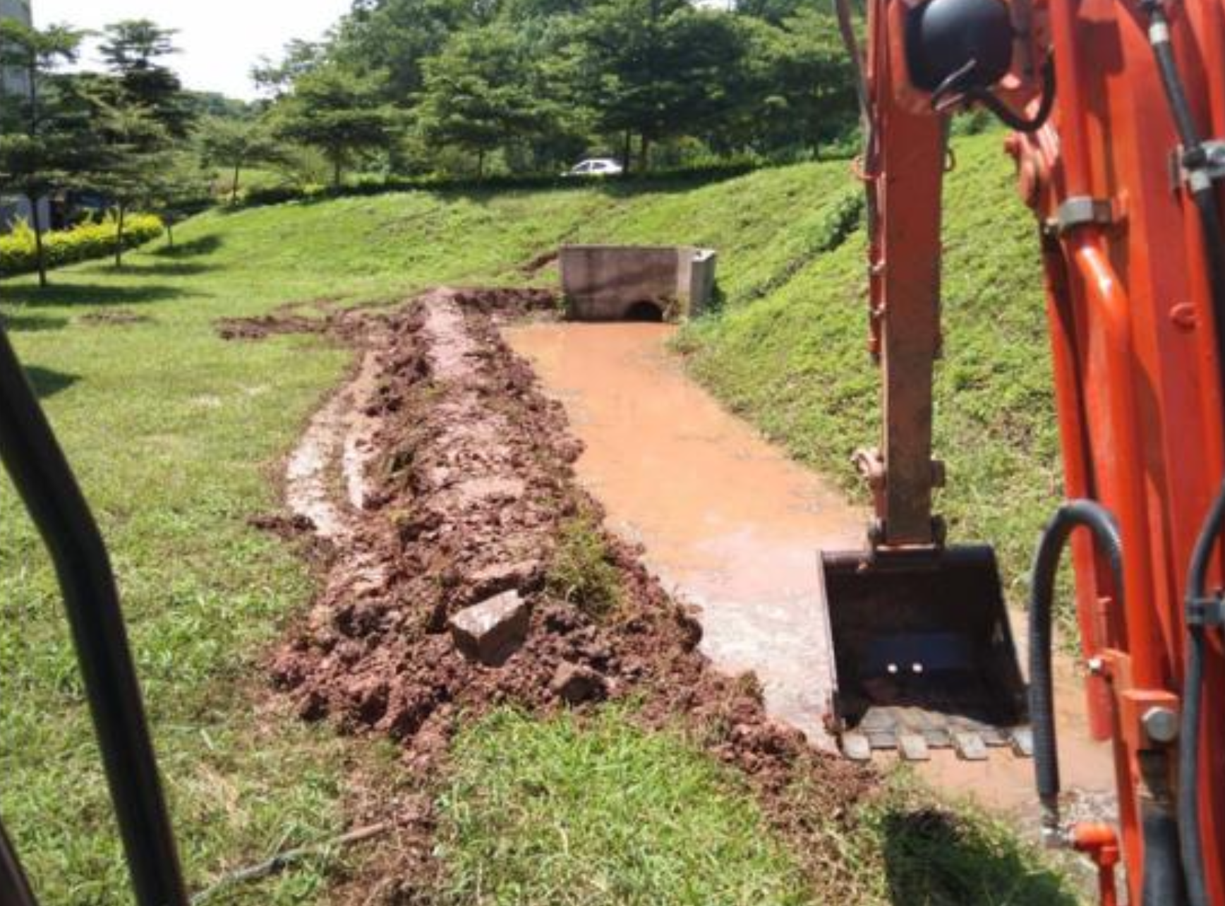 Canal channeling water to support agricultural activities on campus