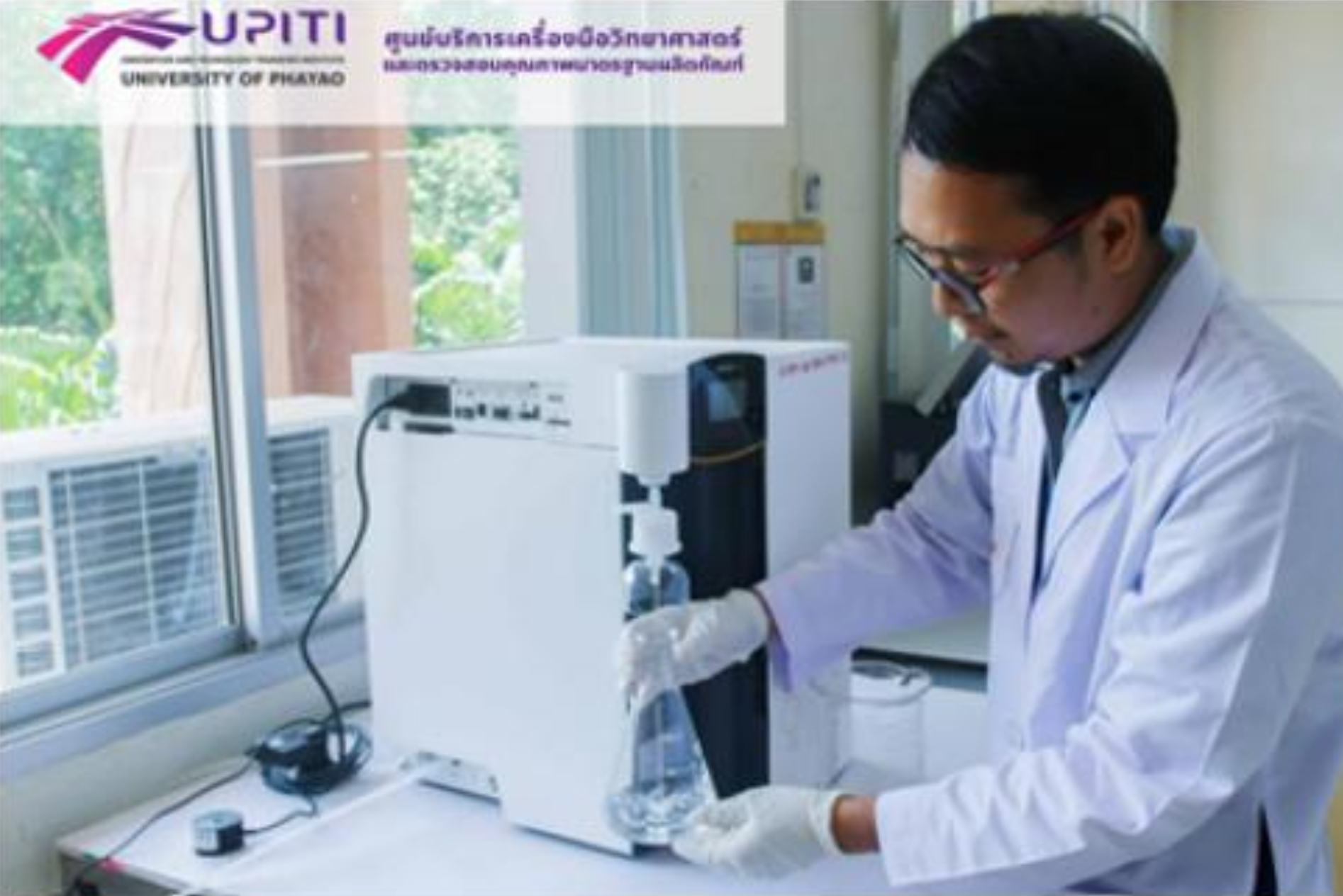 Laboratory staff collecting hazardous waste containers on a cart