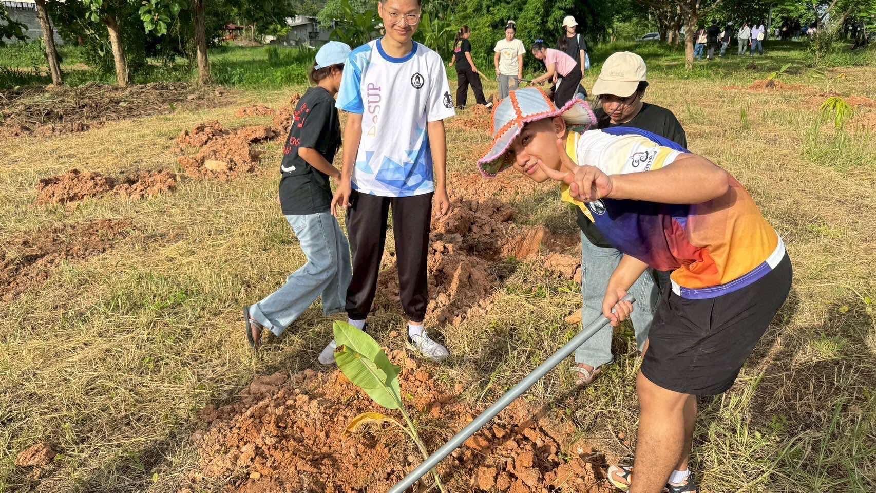 Volunteers planting banana trees, University of Phayao