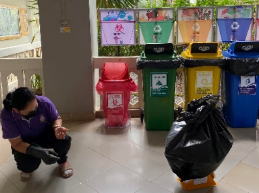 Staff collecting separated waste