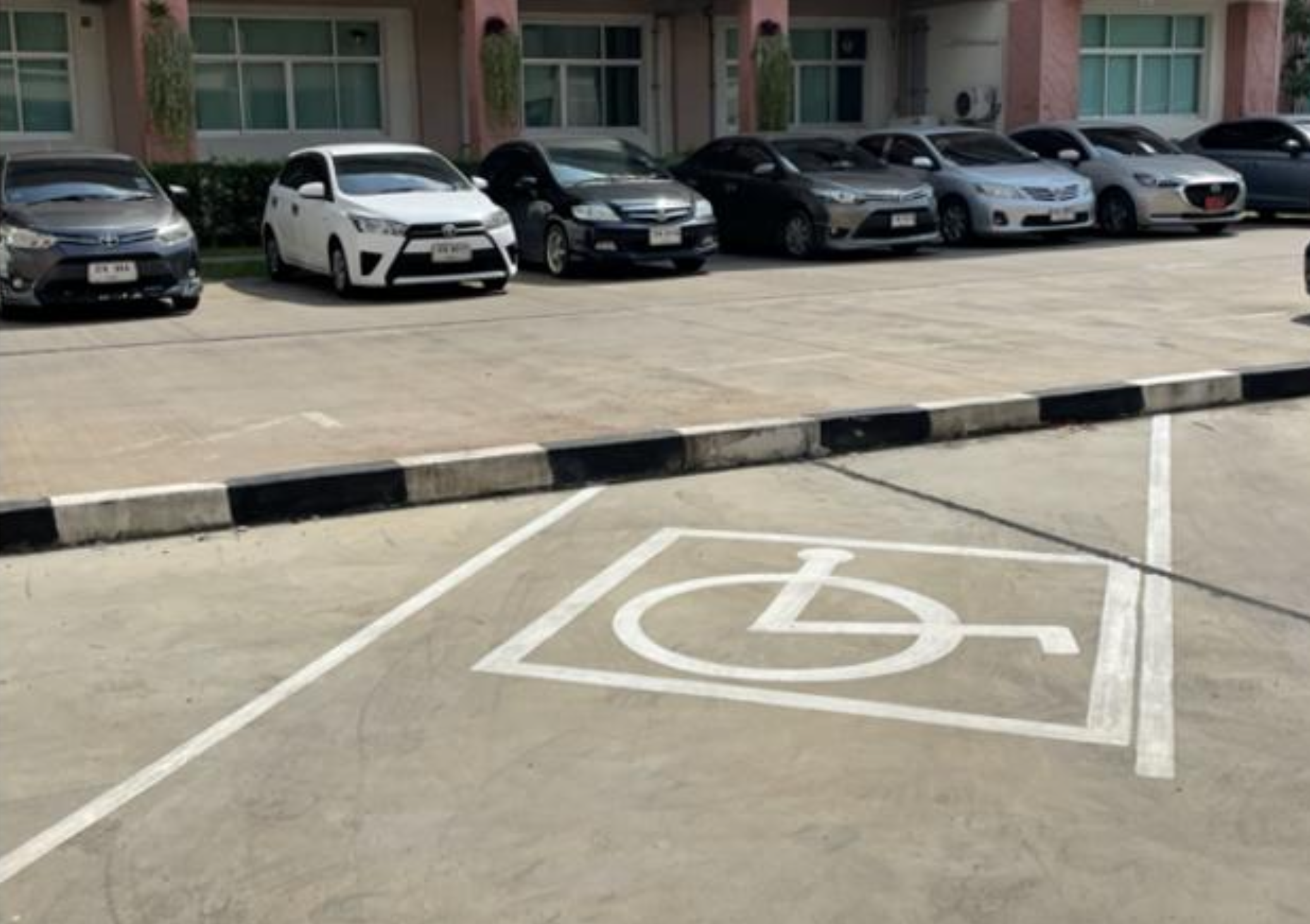 Disabled access parking space with red marking