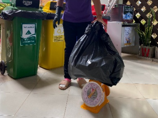 Staff collecting separated waste