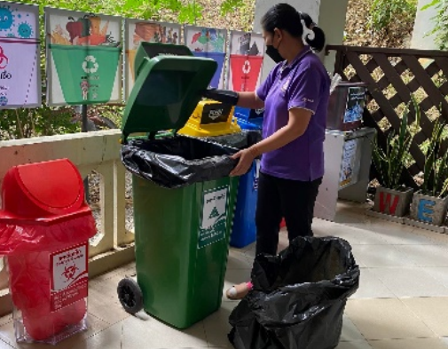 Staff collecting separated waste