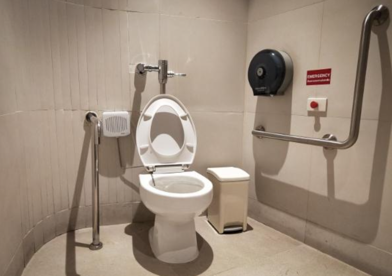 Accessible bathroom door with disability symbol