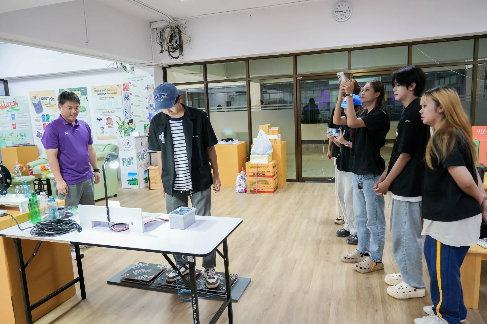 Staff presenting circular economy and sustainable resource use exhibits