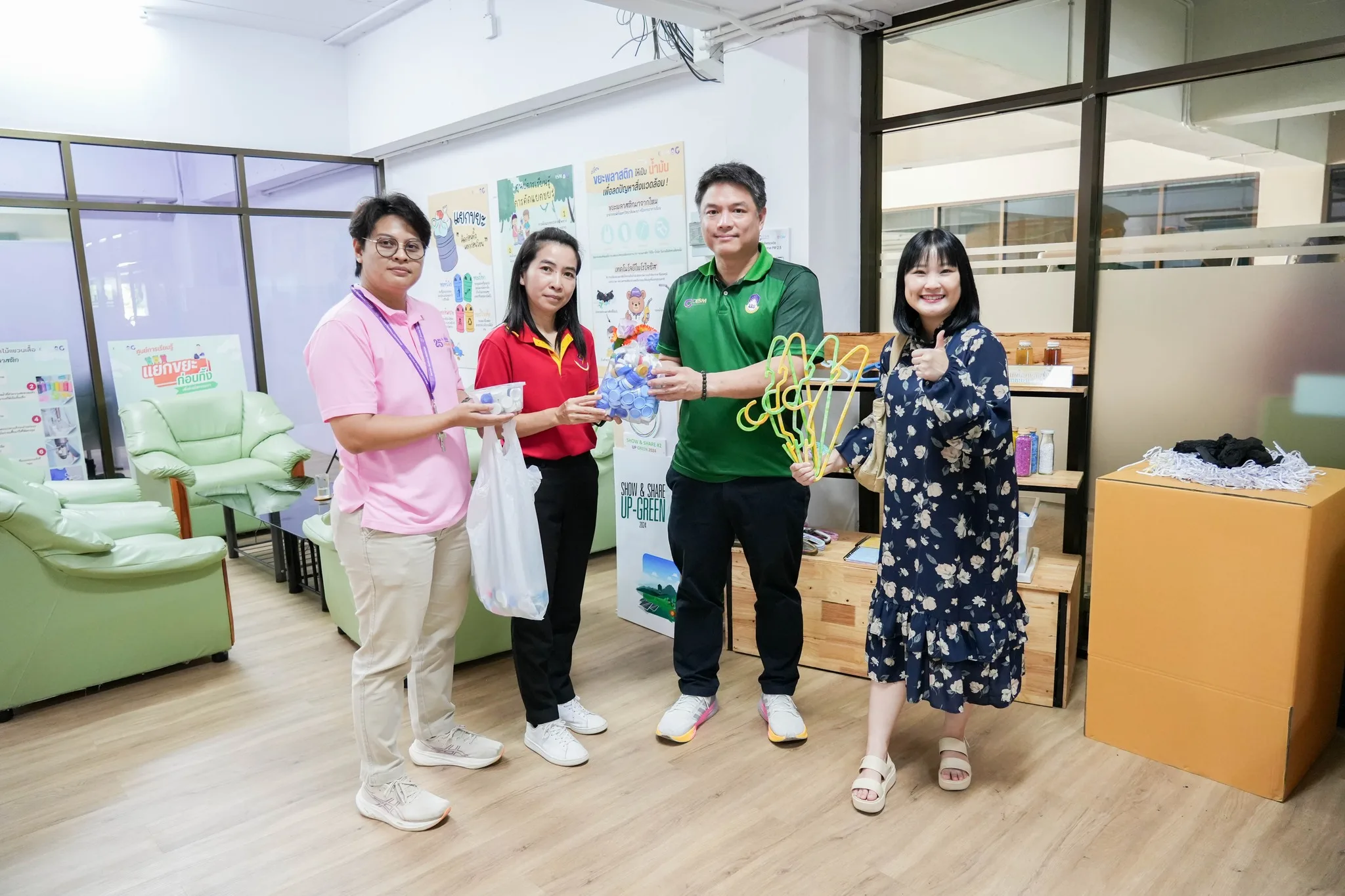 Staff exchanging donated plastic bottles for hangers