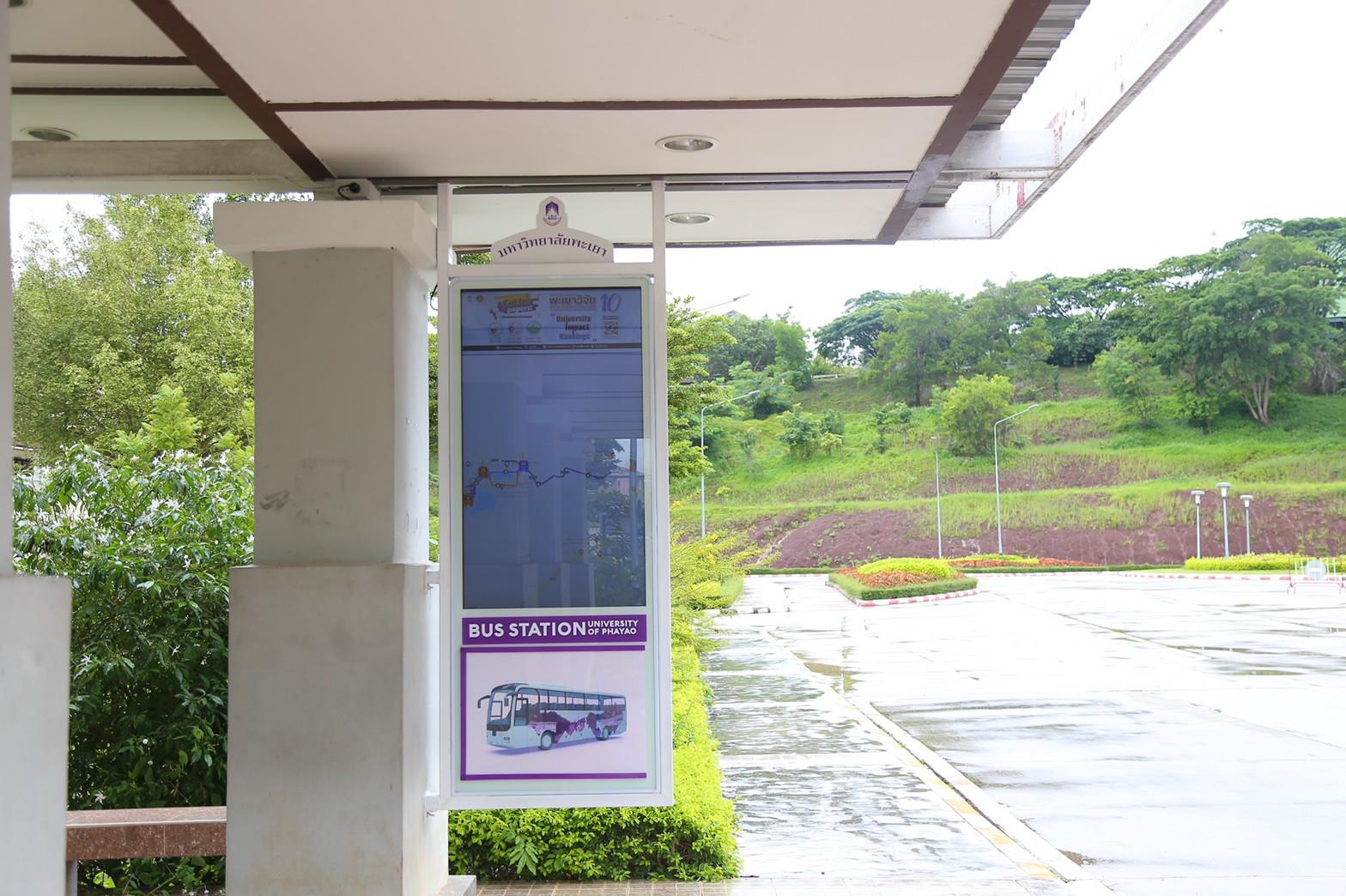 55-inch real-time bus tracker screen at bus stop, University of Phayao