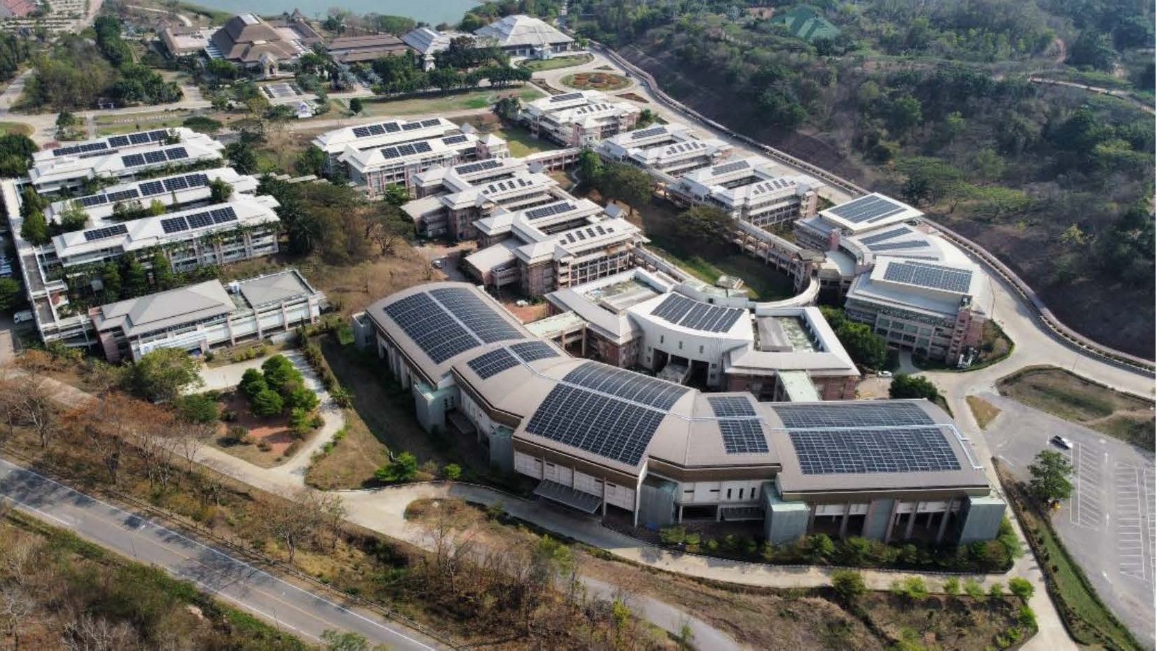 Aerial view of rooftop solar panels on campus buildings