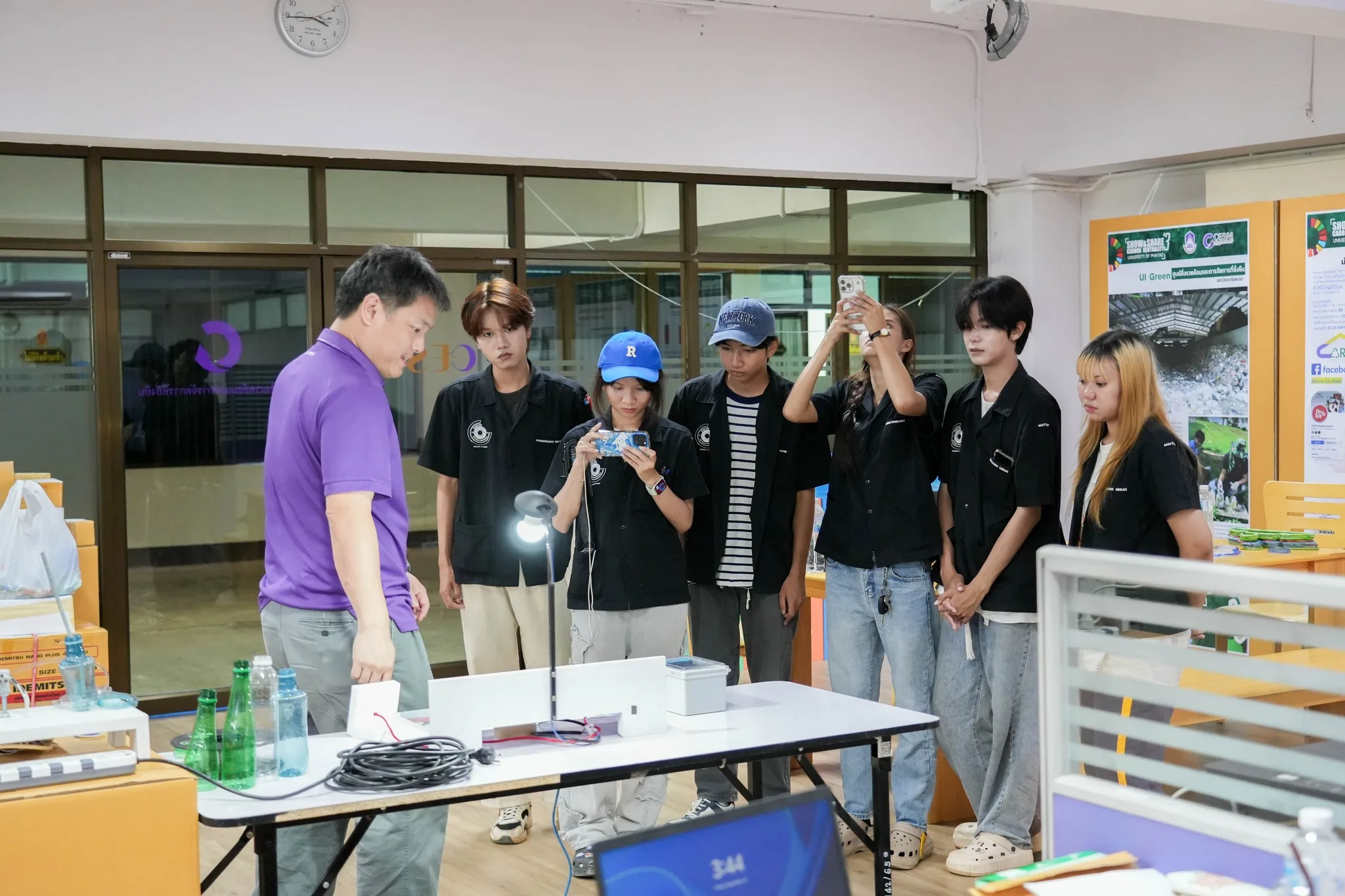 Students and researchers examining circular economy demonstration materials
